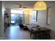 Bright living room featuring a large sliding door to the outdoor space, comfortable seating, and stylish decor at 3650 E Montecito Ave # 4, Phoenix, AZ 85018