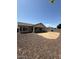 Home exterior featuring a large backyard with stone landscaping at 3700 E Sandwick Dr, San Tan Valley, AZ 85140