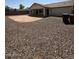Home exterior featuring a large backyard with stone landscaping at 3700 E Sandwick Dr, San Tan Valley, AZ 85140