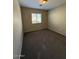 Neutral bedroom featuring carpeted floors and natural light from the window at 3700 E Sandwick Dr, San Tan Valley, AZ 85140