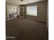 Cozy carpeted bedroom with glass panel french doors at 3700 E Sandwick Dr, San Tan Valley, AZ 85140