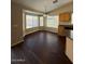Bright dining area with hardwood floors and many windows at 3700 E Sandwick Dr, San Tan Valley, AZ 85140