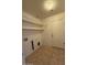 Functional laundry room with tile flooring and shelving at 3700 E Sandwick Dr, San Tan Valley, AZ 85140