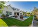 Spacious backyard with a refreshing pool, mature trees, and cozy seating, perfect for outdoor enjoyment at 4007 N 34Th St, Phoenix, AZ 85018