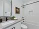 Modern bathroom with a bathtub, a stylish mirror and sleek fixtures, designed for relaxation and functionality at 4007 N 34Th St, Phoenix, AZ 85018