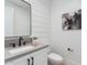 Modern half-bathroom boasts a stylish mirror, floating vanity, and contemporary design at 4007 N 34Th St, Phoenix, AZ 85018