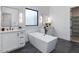 Contemporary bathroom featuring a freestanding tub, dual vanities, and modern fixtures, providing a spa-like experience at 4007 N 34Th St, Phoenix, AZ 85018