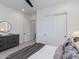 Bright bedroom featuring a sliding closet door, comfortable bed, and a stylish dresser, creating a cozy retreat at 4007 N 34Th St, Phoenix, AZ 85018
