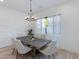 Bright dining room features modern chandelier, a table for six, and elegant wall accents at 4007 N 34Th St, Phoenix, AZ 85018