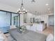 Dining room view, featuring a chandelier, open concept kitchen, and bright natural light at 4007 N 34Th St, Phoenix, AZ 85018