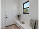 A bright entryway featuring a window, built in bench, and modern decor at 4007 N 34Th St, Phoenix, AZ 85018