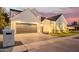 Striking two-story modern farmhouse boasting a lush front lawn, a gray garage door, and elegant exterior lighting at 4007 N 34Th St, Phoenix, AZ 85018