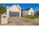 Beautiful two-story modern farmhouse with a lush green lawn, a gray garage door, and stylish landscaping at 4007 N 34Th St, Phoenix, AZ 85018