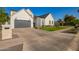 Attractive two-story modern farmhouse features a verdant front lawn, a paved driveway, and a spacious two-car garage at 4007 N 34Th St, Phoenix, AZ 85018