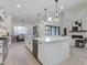 Spacious kitchen features a large island, stainless appliances, and an open layout connecting to the dining and living areas at 4007 N 34Th St, Phoenix, AZ 85018
