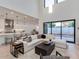 Bright living room with an open floor plan connecting the kitchen, a sliding door, and modern decor at 4007 N 34Th St, Phoenix, AZ 85018