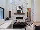 Stylish living room features a modern fireplace, hardwood floors, and an open layout, perfect for entertaining at 4007 N 34Th St, Phoenix, AZ 85018