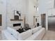 Elegant living room featuring a floor-to-ceiling fireplace, hardwood floors, and an open concept design at 4007 N 34Th St, Phoenix, AZ 85018