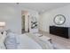 Bedroom featuring ensuite bathroom, light wood floors, and neutral decor at 4007 N 34Th St, Phoenix, AZ 85018