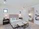 Bright primary bedroom with accent wall, neutral decor, and ensuite bathroom at 4007 N 34Th St, Phoenix, AZ 85018