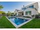 Beautiful backyard featuring a sparkling pool, well-maintained lawn, and stylish seating arrangements at 4007 N 34Th St, Phoenix, AZ 85018