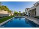 Beautiful pool with lush landscaping and cozy patio seating, perfect for relaxation and outdoor enjoyment at 4007 N 34Th St, Phoenix, AZ 85018