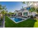 Stunning backyard featuring a pool, seating, and manicured lawn, ideal for outdoor living and entertaining at 4007 N 34Th St, Phoenix, AZ 85018