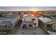 Aerial view showcasing the backyard of a two-story home featuring a tiled roof, a covered patio, and solar panels at 4115 S 180Th Dr, Goodyear, AZ 85338