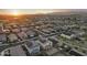 Expansive aerial view of a residential area with neatly arranged homes, highlighting community living with a scenic backdrop at 4115 S 180Th Dr, Goodyear, AZ 85338