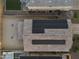 Aerial rooftop view showcasing a house with solar panels and a tiled roof, complemented by a spacious backyard at 4115 S 180Th Dr, Goodyear, AZ 85338