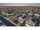 An aerial view of a residential neighborhood showing homes with solar panels, nearby park and meticulously planned streets at 4115 S 180Th Dr, Goodyear, AZ 85338