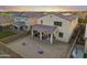 A spacious backyard features a covered patio perfect for outdoor dining and leisure, with ample space for activities at 4115 S 180Th Dr, Goodyear, AZ 85338