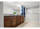 Elegant bathroom with double vanity, granite counters, and a combined shower/tub at 4115 S 180Th Dr, Goodyear, AZ 85338