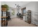 Bright bedroom with a ceiling fan, two windows, and a neutral carpet, perfect for an office at 4115 S 180Th Dr, Goodyear, AZ 85338