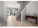Neutral entryway with access to carpeted stairs, leading to an outdoor space through sliding glass doors at 4115 S 180Th Dr, Goodyear, AZ 85338