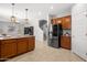 Spacious kitchen with stainless steel appliances, granite countertops, and pendant lighting at 4115 S 180Th Dr, Goodyear, AZ 85338