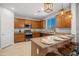 Bright kitchen featuring granite countertops, stainless steel appliances, and a breakfast bar with seating at 4115 S 180Th Dr, Goodyear, AZ 85338