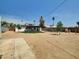 Large backyard with desert landscaping, grass patch and in-ground pool at 4337 E Wilshire Dr, Phoenix, AZ 85008