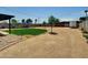 Expansive backyard with lush grass, desert landscaping and pool at 4337 E Wilshire Dr, Phoenix, AZ 85008