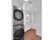 Modern bathroom boasts a tub/shower combo, a vanity, and laundry located within at 4337 E Wilshire Dr, Phoenix, AZ 85008