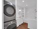 Modern bathroom boasts a tub/shower combo, a vanity, and laundry located within at 4337 E Wilshire Dr, Phoenix, AZ 85008