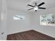 Cozy bedroom featuring wood-look flooring and a sunlit window with blinds at 4337 E Wilshire Dr, Phoenix, AZ 85008