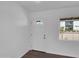 Bright entryway featuring updated door and hardware, new flooring and window with bright natural light at 4337 E Wilshire Dr, Phoenix, AZ 85008