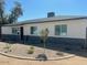 Charming home with new paint, updated windows, stacked stone accent and low maintenance desert landscaping at 4337 E Wilshire Dr, Phoenix, AZ 85008