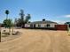 Well maintained home on oversized lot with desert landscaping, mature trees, and circular driveway at 4337 E Wilshire Dr, Phoenix, AZ 85008