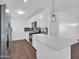 Modern kitchen features stainless steel appliances, quartz countertops, and sleek cabinetry at 4337 E Wilshire Dr, Phoenix, AZ 85008