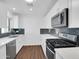 Modern kitchen features stainless steel appliances, quartz countertops, and sleek cabinetry at 4337 E Wilshire Dr, Phoenix, AZ 85008