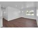 Open concept living space with new flooring, fresh paint, updated fixtures and bright natural light at 4337 E Wilshire Dr, Phoenix, AZ 85008