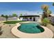 Backyard features a large pool, grassy area and drought tolerant landscaping at 4337 E Wilshire Dr, Phoenix, AZ 85008