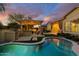 Beautiful backyard with a pool, built-in grill, and covered patio, ideal for entertaining and enjoying outdoor living at 4450 S Frequency --, Mesa, AZ 85212